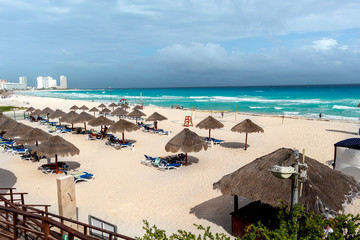 Fototapeta na wymiar beach with lounge chairs and umbrellas