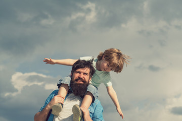 Father and son. Family Time. Daddy and child son. Happy kid playing - airplane. Portrait of happy...