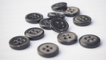 The buttons of the shirt are black