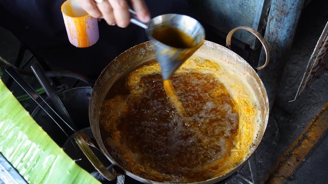 Made fios de ovos or foi tong dessert from Thailand. Foi Tong (Shredded Egg Yolk Tart)