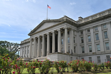Fototapeta na wymiar American Flag on The UNITED STATES CAPITOL, WASHINGTON, D.C.