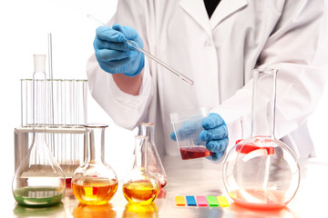 Chemical laboratory. Analytical chemistry. Laboratory technician takes a sample of the substance for testing. Chemical composition of substances. Chemical reactions in solutions. Laboratory research.