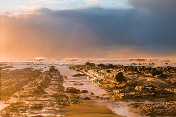 Waves and Rocks at Beach at Sunrise