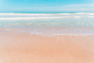 Tropical nature clean beach and white sand in summer with sun light blue sky and bokeh background.