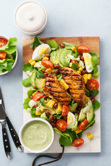 Grilled chicken breast and fresh vegetable salad. Healthy food.