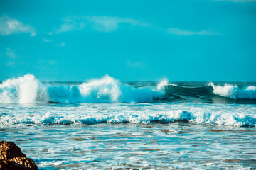 Waves and Rocks at Beach at Sunrise