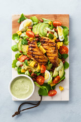 BBQ chicken cobb salad with avocado ranch dressing.