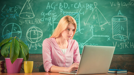 Remote education. Student adorable blonde girl classroom chalkboard background. STEM concept. Formal education. Confident woman with laptop working online teacher. Modern education. Back to school