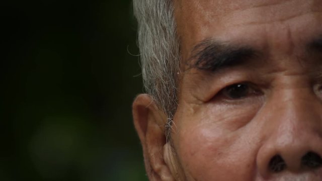 Close-up portrait of a elderly man thinking about something