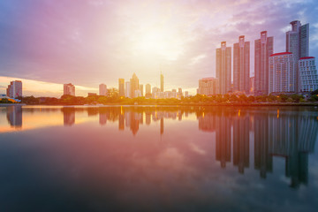 Fototapeta premium City building with water reflection before sunset