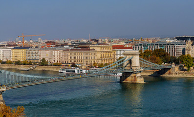 Obraz premium The view from the hill to the chain bridge in Budapest the Danube river. General panorama of the city