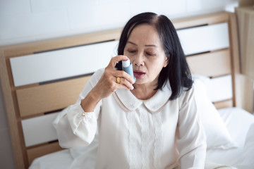 asthma suffers air allergy in old people women Asian - obrazy, fototapety, plakaty