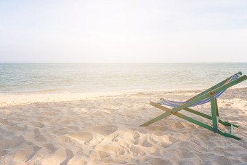 empty wooden beach chair at the beach