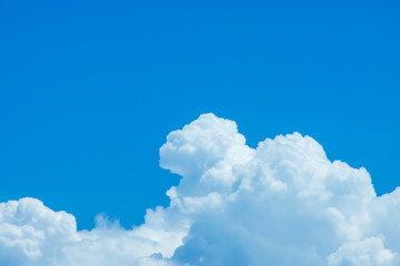 Naklejka premium Blue sky background with white clouds.