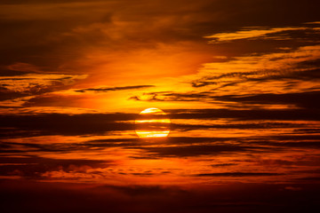 Fototapeta na wymiar Sunset sky at the lake with silhouette cloud.