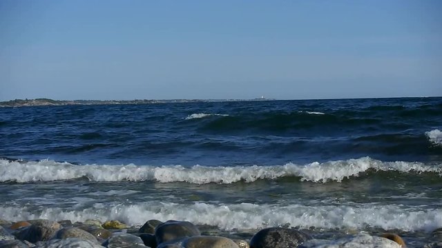 Waves crashing in on Sweden's most famous shoreline for windsurfing in Stockholms south archipelago.