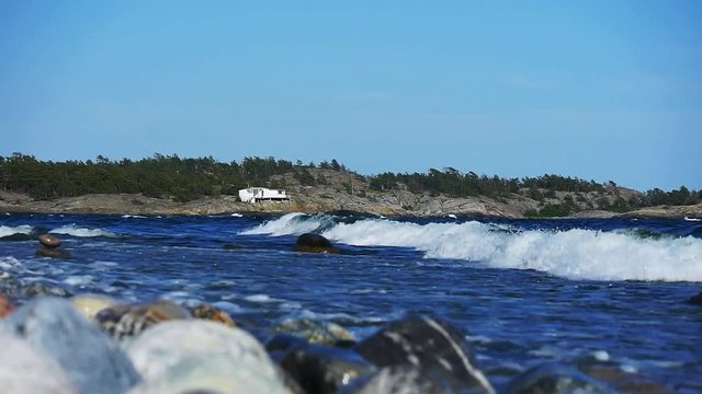 Waves crashing on Sweden's most famous shoreline for windsurfing in Stockholms south archipelago.