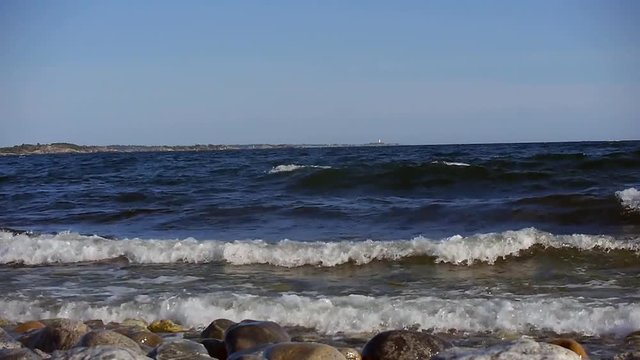 Waves crashing in on Sweden's most famous shoreline for windsurfing in Stockholms south archipelago.