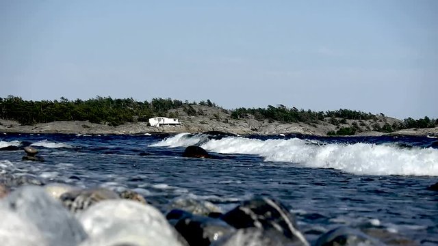 Waves crashing on Sweden's most famous shoreline for windsurfing in Stockholms south archipelago.