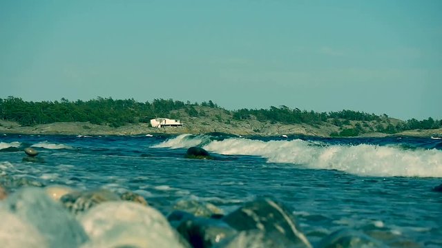 Waves crashing on Sweden's most famous shoreline for windsurfing in Stockholms south archipelago.