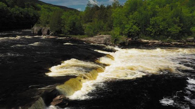 Slide left over Nesowdnehunk Falls on the Penobscot River in Baxter State Park AERIAL