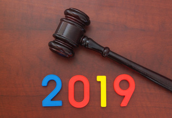 Wooden judge gavel and numbers 2019. Concept of new laws of 2019 year
