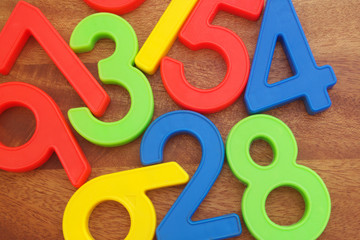 Colorful numbers on wooden board