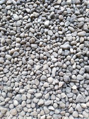 pebbles in front of house