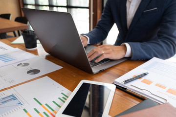 Businessmen, finance, accounting work, checking accounts, using calculators and finding information