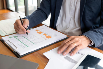 Businessmen, finance, accounting work, checking accounts, using calculators and finding information