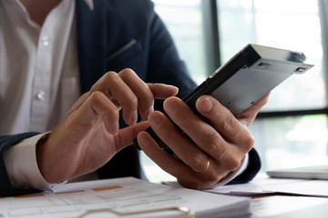 Businessmen, finance, accounting work, checking accounts, using calculators and finding information