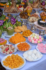 Sacrificial offering food for pray to god and memorial to ancestor, Bangkok, Thailand. Traditional offerings to gods with food, vegetable and fruit for the gods of Thai culture