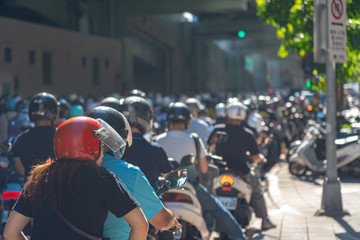 Scooter waterfall in Taiwan. Traffic jam crowded of motorcycles at rush hour on the ramp of Taipei Bridge, Cascade of scooters on Minquan West Road in Datong District, Taipei, Taiwan