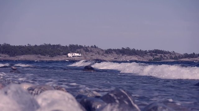 Waves crashing on Sweden's most famous shoreline for windsurfing in Stockholms south archipelago.