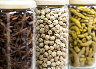 Set of dried spices and herbs in glass bottles , Variety of spices