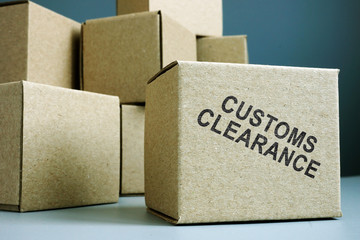 Customs clearance stamp on a side of box. - obrazy, fototapety, plakaty