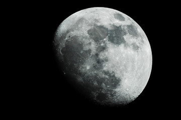 The moon shines on a black background.