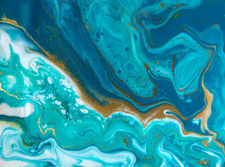 Fototapeta premium Blue and gold marbling pattern. Golden marble liquid texture.