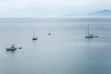 Yachts in the sea, view from above. Blue haze, beautiful landscape.