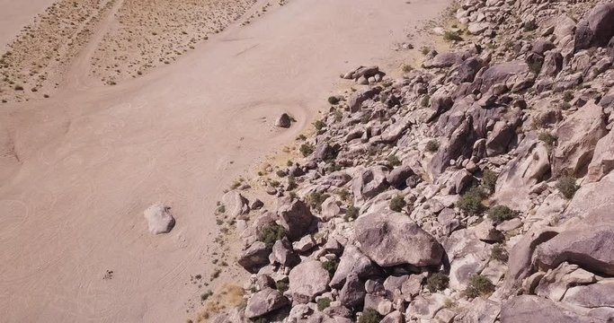 flying drone up to the Mojave Mountains boulder rock formations panoramic shot