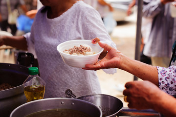 The Hand of the Beggars receives charity food from fellow human beings : The concept of...