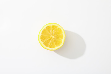 Fresh lemon on white background, space for text