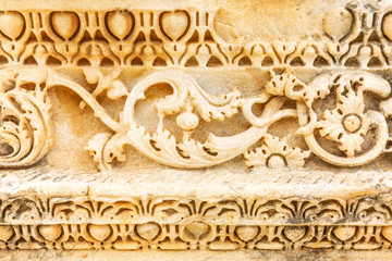 Ornament on antique construction. Texture, close-up.