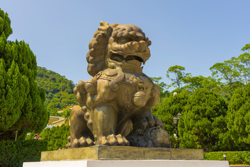 Golden guardian lion in front of Gu Gong National Palace Museum in Taipei,Taiwan. - obrazy, fototapety, plakaty