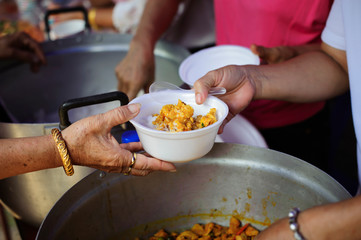 Concept homelessness : Food needs of the poor in society Help with Food Donation : Homeless people pick up charity food from the food donors in society : The concept of the beggar problem on earth