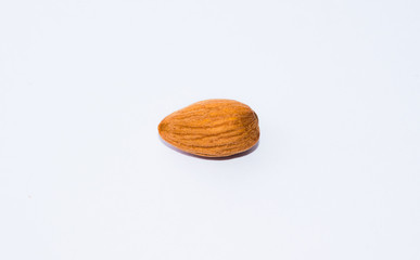 close up of  brown almond seed isolated on white background