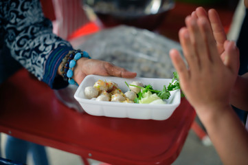 The Concept of Hunger : Food needs of the poor in society Help with Food Donation : Homeless people pick up charity food from the food donors in society : The concept of the beggar problem on earth