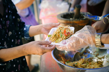 The Concept of Hunger : Food needs of the poor in society Help with Food Donation : Homeless people pick up charity food from the food donors in society : The concept of the beggar problem on earth