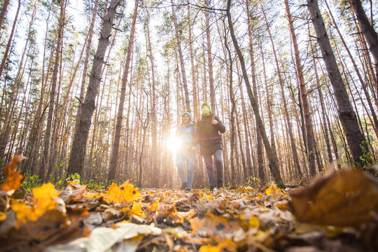 Adventures, Tourism And Nature Concept - Low-angle Shot Of Walking Hike Couple In A Distance