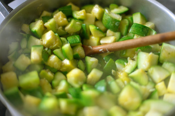 Macro close-up of zapallitos cut into pieces boiling in a pan